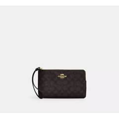 COACH - A large signature brand printed artificial leather clutch CZ277